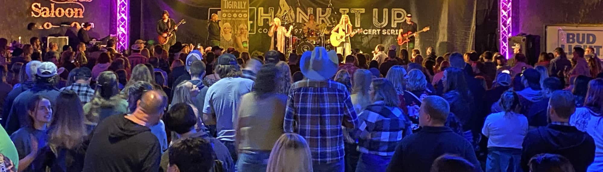 country concert with fans wearing cowboy hats Atlanta